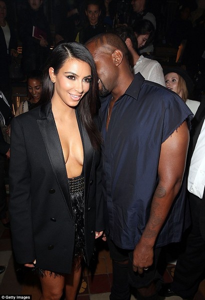 Kim Kardashian appears topless under open tuxedo jacket  